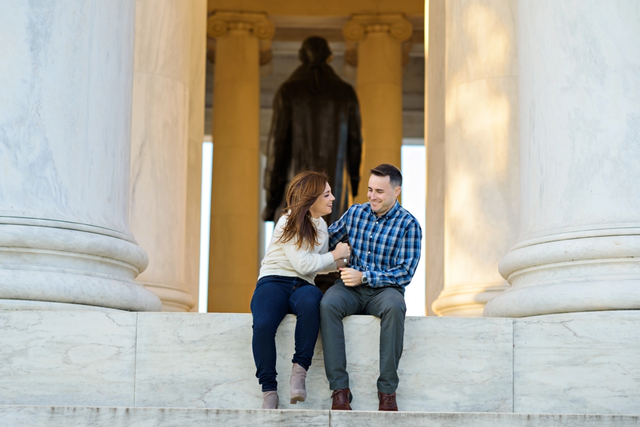 A fun couple tickle each other on the steps of the Lincoln Memorial.
